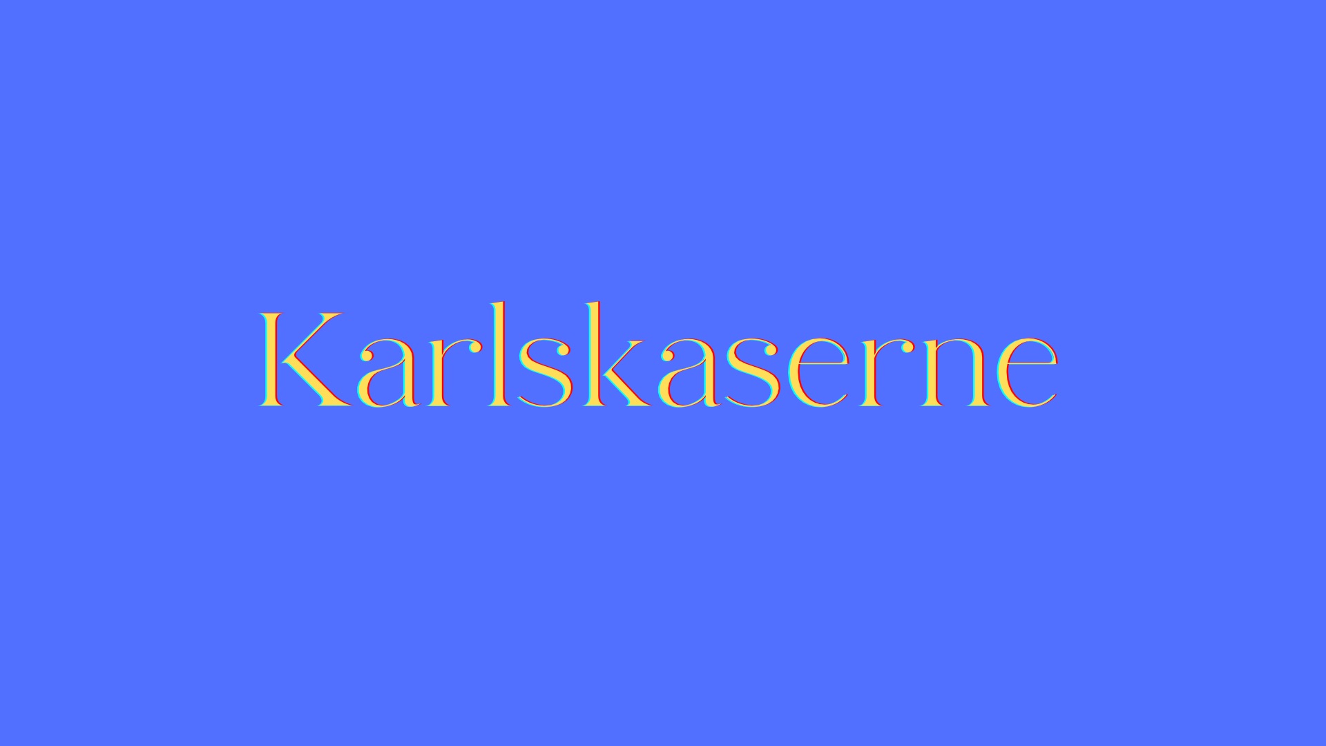 Gelber Schriftzug „Karlskaserne“ auf einem hellblauen Hintergrund.
